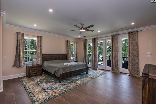 bedroom featuring dark wood-type flooring, access to outside, multiple windows, and ceiling fan