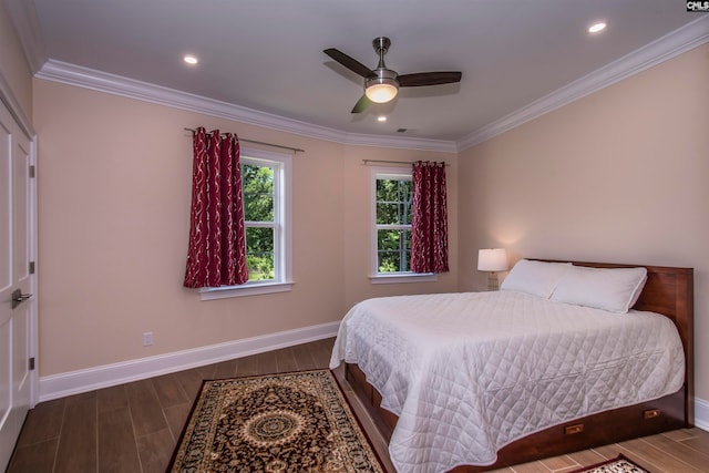 bedroom with ceiling fan, dark hardwood / wood-style floors, and crown molding