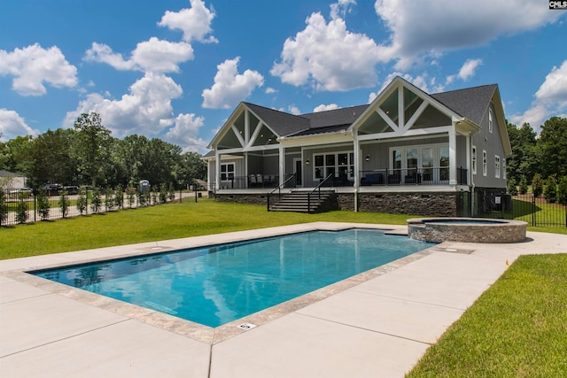 back of property featuring a pool with hot tub, a patio, a lawn, and ceiling fan