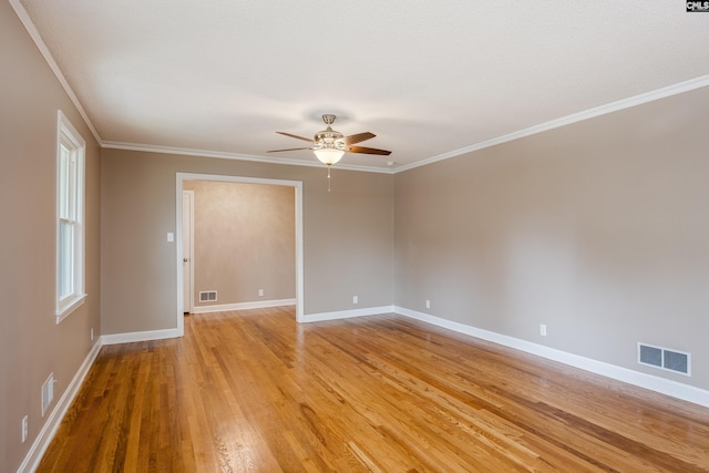 spare room featuring ceiling fan, light hardwood / wood-style flooring, and crown molding