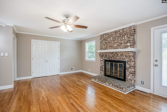 unfurnished living room with a fireplace, ornamental molding, hardwood / wood-style floors, and ceiling fan