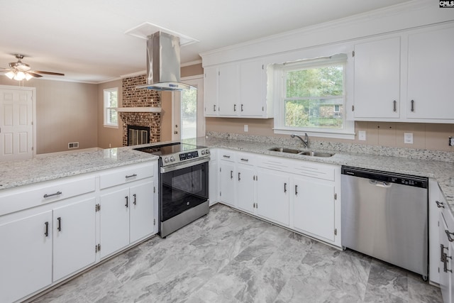 kitchen with island exhaust hood, sink, kitchen peninsula, appliances with stainless steel finishes, and white cabinetry