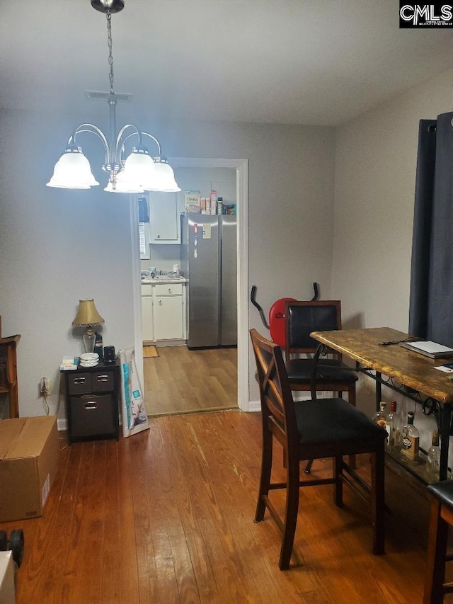 1518 Woodlawn Dr, Camden, SC 29020 - dining space featuring hardwood / wood-style floors and an inviting chandelier