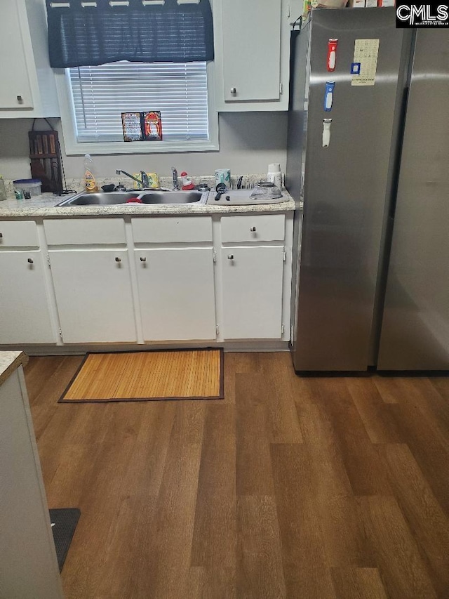 1518 Woodlawn Dr, Camden, SC 29020 - kitchen with freestanding refrigerator, light countertops, a sink, and wood finished floors
