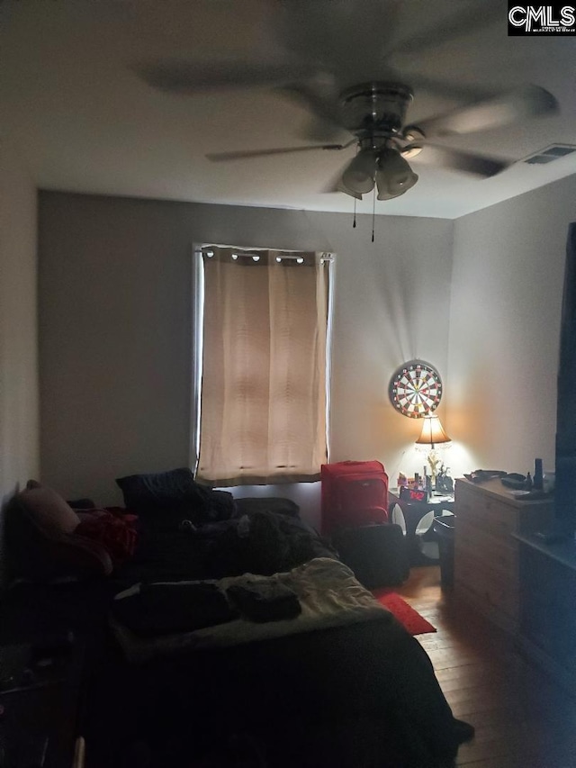 1518 Woodlawn Dr, Camden, SC 29020 - bedroom with visible vents, wood finished floors, and a ceiling fan