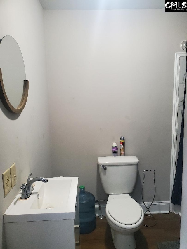 1518 Woodlawn Dr, Camden, SC 29020 - bathroom featuring toilet, baseboards, vanity, and wood finished floors