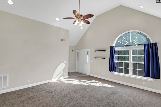 unfurnished living room featuring ceiling fan, carpet flooring, and high vaulted ceiling