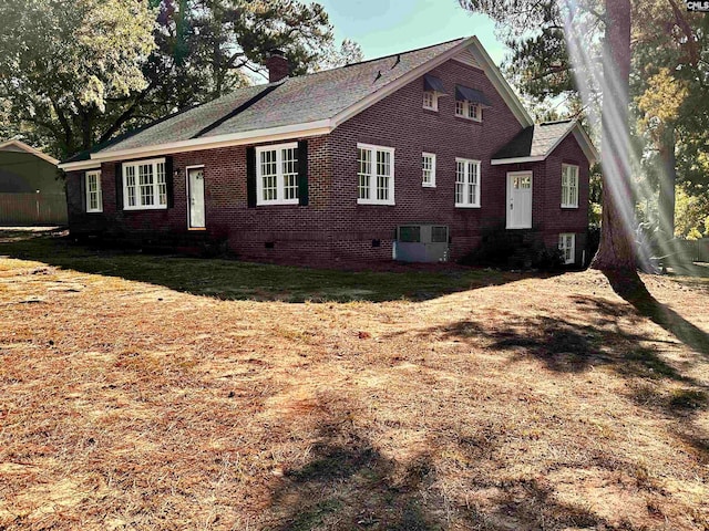 view of side of property featuring central AC unit