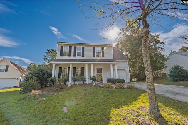 view of front of house featuring a garage, a porch, and a front lawn