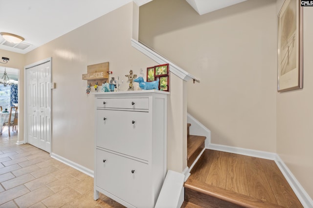 stairway with hardwood / wood-style floors