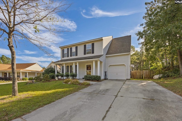 view of front property featuring a front lawn, covered porch, and a garage