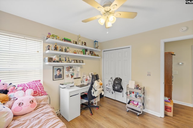 office space with ceiling fan and light wood-type flooring