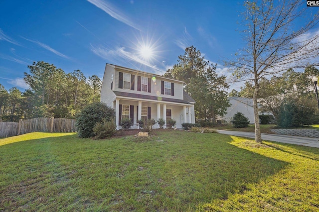 view of front of property featuring a front yard and a porch