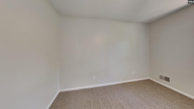 empty room featuring carpet flooring