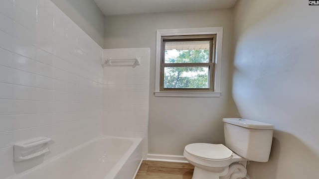 bathroom featuring hardwood / wood-style floors, toilet, and shower / bath combination