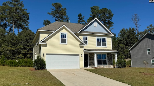 view of front of property with a front lawn and a garage