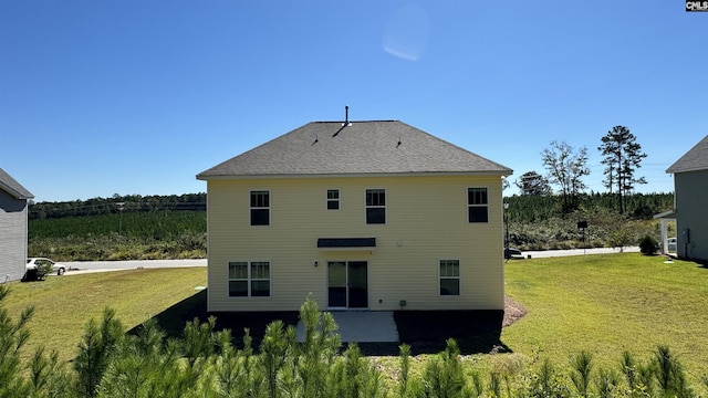 back of house with a yard