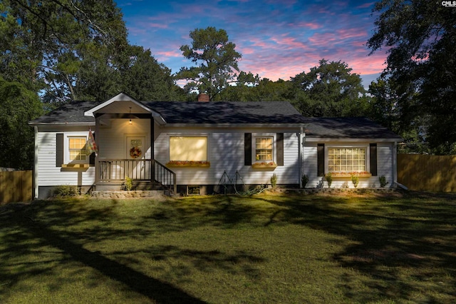 view of front of house with a yard