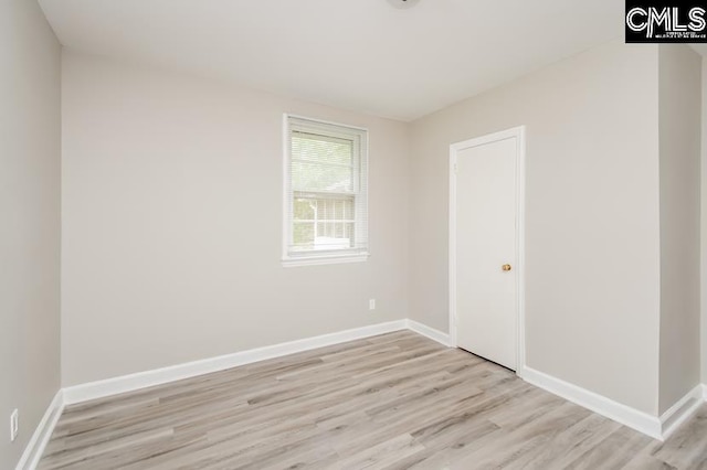 spare room with light hardwood / wood-style floors