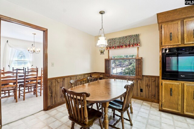 886 Polson Rd, Camden, SC 29020 - dining space featuring a healthy amount of sunlight, light floors, wainscoting, and wood walls