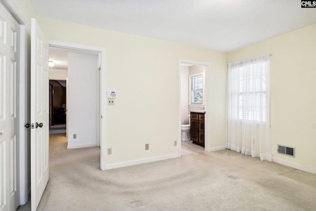886 Polson Rd, Camden, SC 29020 - unfurnished bedroom with visible vents, baseboards, and light colored carpet