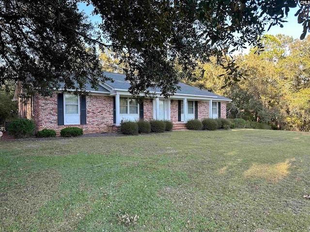 ranch-style house with a front yard