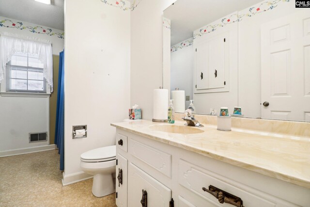 886 Polson Rd, Camden, SC 29020 - full bathroom with visible vents, baseboards, toilet, and vanity