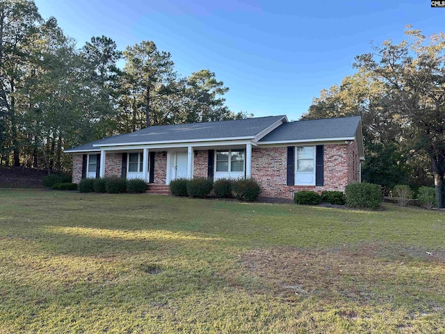 ranch-style house with a front lawn