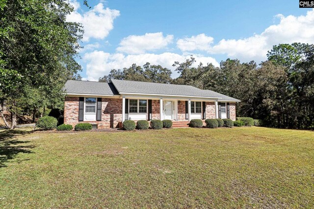 886 Polson Rd, Camden, SC 29020 - ranch-style house featuring a front lawn and brick siding