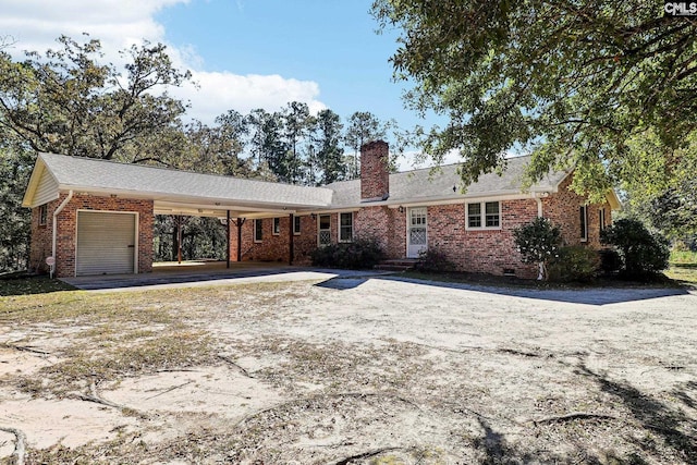 886 Polson Rd, Camden, SC 29020 - ranch-style home with a garage, dirt driveway, a chimney, and brick siding