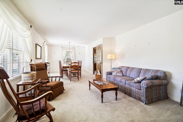 886 Polson Rd, Camden, SC 29020 - living room featuring baseboards, a notable chandelier, and light carpet