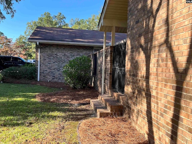 view of property exterior with a yard