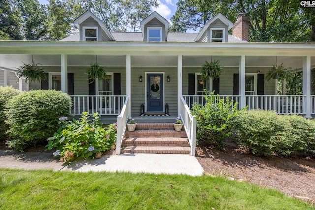 cape cod home with covered porch