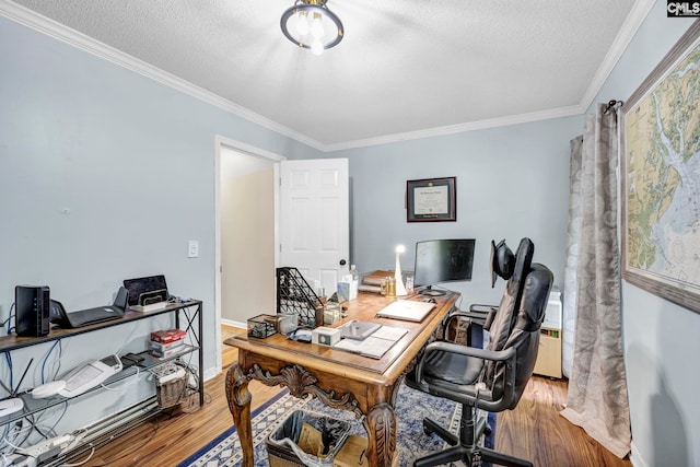 office featuring hardwood / wood-style flooring, crown molding, and a textured ceiling