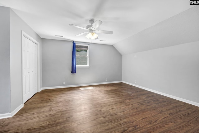 bonus room featuring ceiling fan, dark hardwood / wood-style floors, and vaulted ceiling