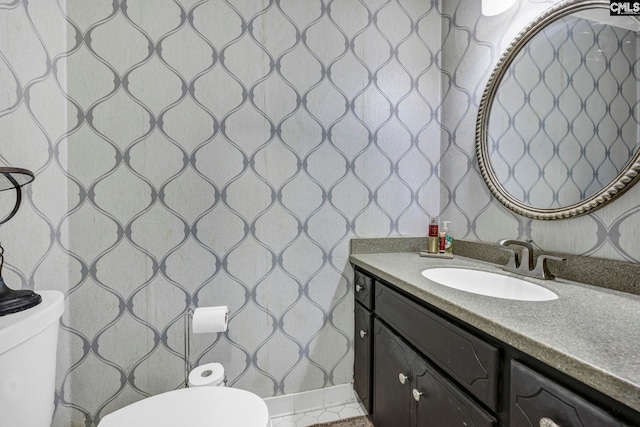 bathroom featuring vanity and toilet