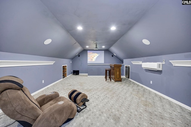 cinema room featuring vaulted ceiling, carpet, and a wall unit AC