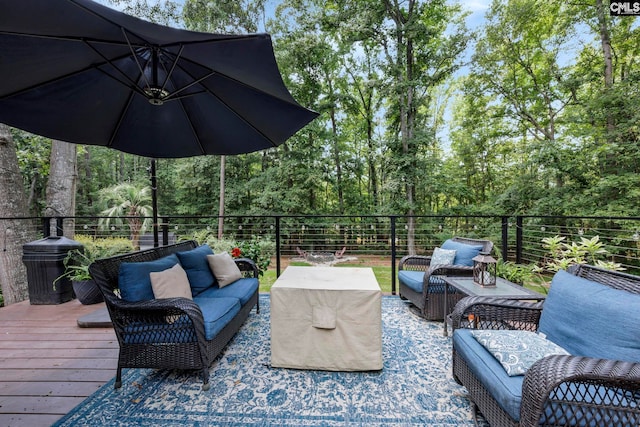 wooden terrace featuring outdoor lounge area