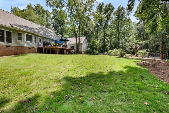 view of yard with a wooden deck