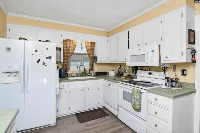 kitchen with ornamental molding, white cabinetry, white appliances, and sink