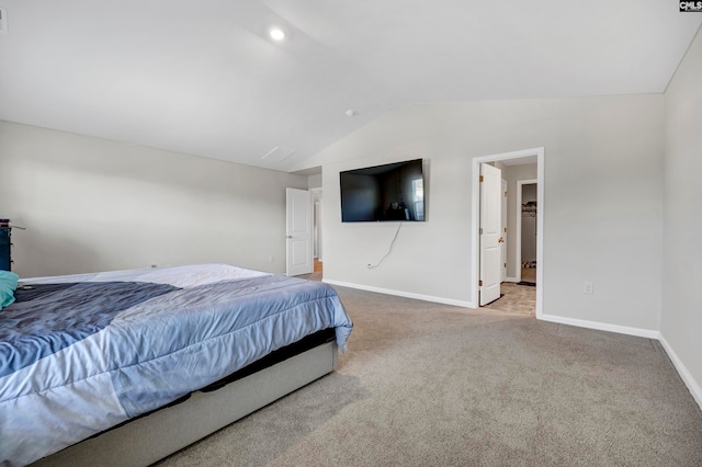 bedroom featuring carpet floors and lofted ceiling