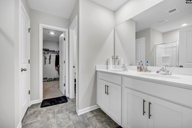 bathroom featuring vanity and an enclosed shower