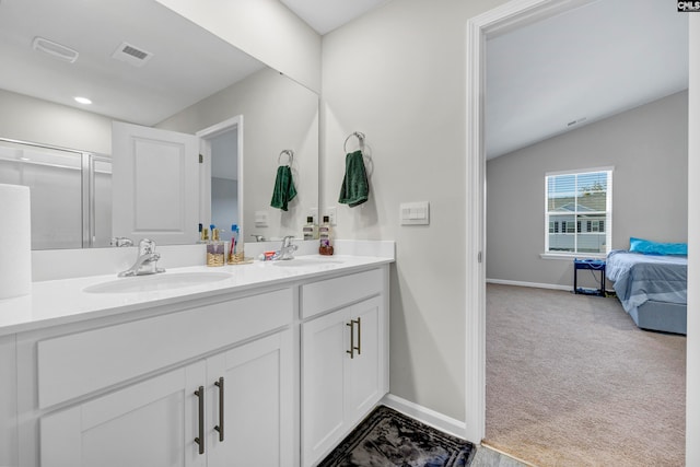 bathroom with vaulted ceiling and vanity