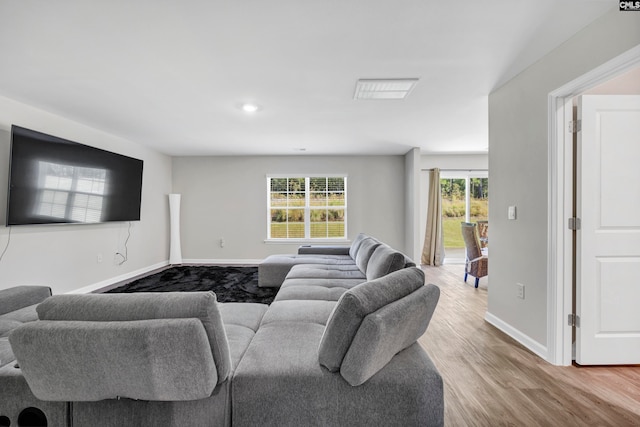 living room with light hardwood / wood-style floors