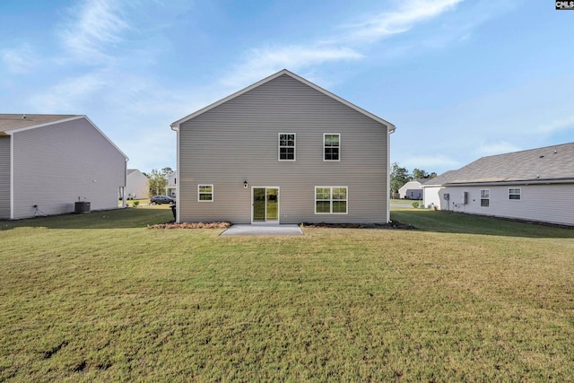 back of property with a patio and a lawn