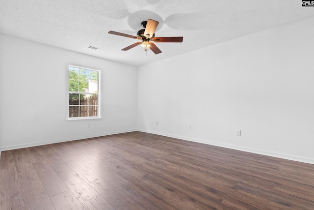 unfurnished room with dark hardwood / wood-style flooring, a textured ceiling, and ceiling fan