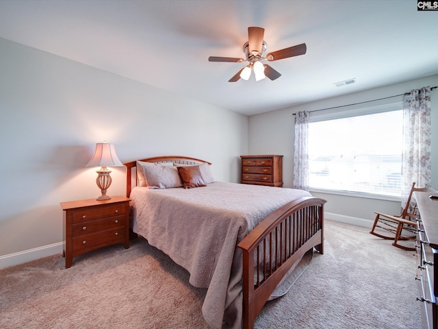 bedroom featuring light colored carpet and ceiling fan