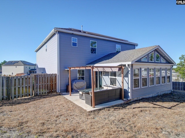 back of property with a patio