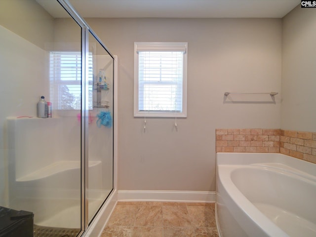 bathroom featuring tile patterned flooring and shower with separate bathtub