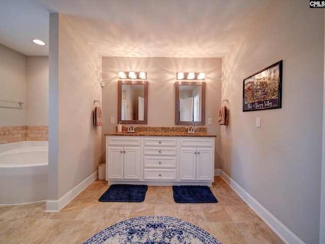 bathroom with a bathtub and vanity